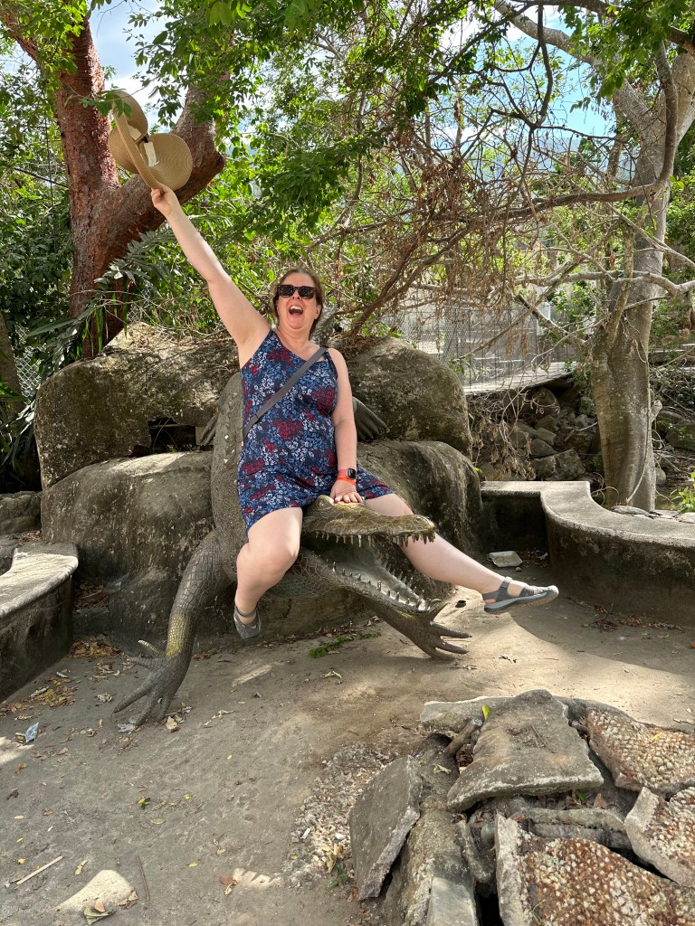 Charlotte riding an alligator (not a real one)